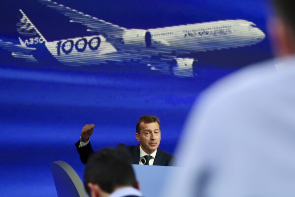 Airbus CEO Guillaume Faury presents the European aerospace giant full year results, Thursday, Feb. 15, 2024 in Blagnac, near Toulouse, southwestern France. (AP Photo/Fred Scheiber)