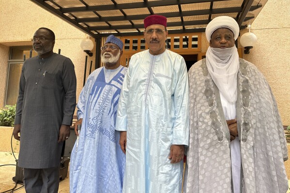 From left; President of the ECOWAS Commission, Mousa Tourey, ECOWAS Special Envoy to Republic of Niger, General Abdulsalami Abubakar, Niger ousted President Mohamed Bazoum and Sultan of Sokoto Alhaji Muhammad Saad Abubakar III, pose in Niamey, Niger, Saturday, Aug. 19, 2023. An official present at talks between Niger's mutinous soldiers and a delegation from West Africa's regional bloc tells The Associated Press that talks Saturday, Aug. 19, 2023, yielded little and that the soldiers are under pressure from regional sanctions as they refuse to reinstate the country’s president whom they toppled nearly a month ago while being fearful of attacks from France.. (AP Photo, File)