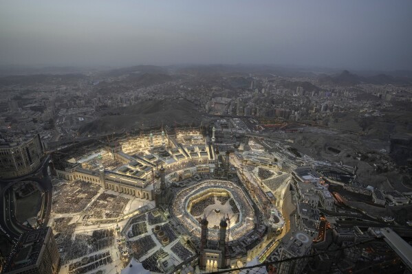 A general view of the Grand Mosque is seen from the Clock Tower during the Hajj pilgrimage in the Muslim holy city of Mecca, Saudi Arabia, Thursday, June 22, 2023. Mecca is Islam's holiest city and a focal point for the faith's followers. But it's also a place where around 2 million people live, work, and do everyday activities like laundry, grocery shopping, homework, putting the trash out and paying the bills. Traffic, the population and prices balloon during the peak Ramadan and Hajj seasons. (AP Photo/Amr Nabil)