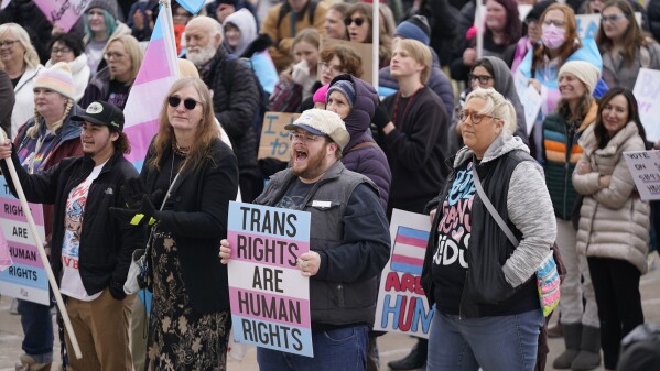 FILE -People gather in support of transgender youth during a rally at the Utah State Capitol Tuesday, Jan. 24, 2023, in Salt Lake City. New laws targeting LGBTQ+ people are proliferating in GOP-led states, but often absent from policy decisions is a clear understanding of how many people will be directly affected. (AP Photo/Rick Bowmer,File)