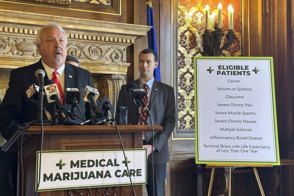 FILE - Republican Rep. Jon Plumer unveils a GOP proposal to legalize medical marijuana in Wisconsin at a Capitol news conference on Monday, Jan. 8, 2024, in Madison, Wis. Wisconsin Republicans appear to be at an impasse over a proposal to legalize medical marijuana. Assembly Speaker Robin Vos said Tuesday, Jan. 16, 2024, that he would not compromise with state Senate Republicans to address their concerns with his proposal. (AP Photo/Scott Bauer, File)