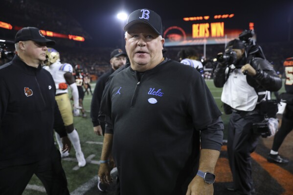 FILE - UCLA coach Chip Kelly walks off the field following the team's NCAA college football game against Oregon State Saturday, Oct. 14, 2023, in Corvallis, Ore. Chip Kelly has informed UCLA officials that he is stepping down as coach of the Bruins, a person with direct knowledge of the decision told The Associated Press on Friday, Feb. 9, 2024. (AP Photo/Amanda Loman, File)