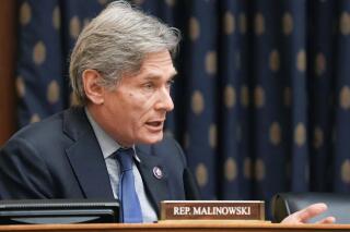 FILE - In this March 10, 2021, file photo, Rep. Tom Malinowski, D-N.J., speaks during a hearing on Capitol Hill in Washington. Malinowski has scolded those looking to capitalize on the once-in-a-century pandemic.  But the two term Democrat is not heeding his own admonition. Records show he's bought or sold as much as $1 million of stock in medical and tech companies that had a stake in the virus response. (Ken Cedeno/Pool via AP, File)