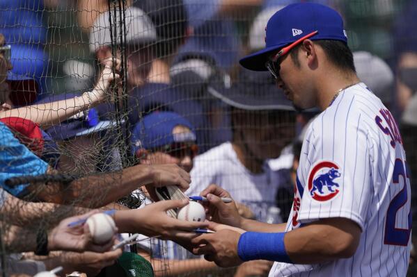 Chicago Cubs' Javier Baez signs autographs in the stands of