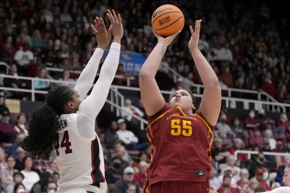 Iowa State center Audi Crooks (55) shoots against Stanford forward Kiki Iriafen (44) during the first half of a second-round college basketball game in the women's NCAA Tournament in Stanford, Calif., Sunday, March 24, 2024. (AP Photo/Jeff Chiu)