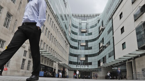 FILE - A view of the main entrance to the headquarters of the publicly funded BBC in London, Wednesday, July 19, 2017. Senior British politicians on Sunday, July 9, 2023 called on the BBC to rapidly investigate a complaint that a leading presenter paid a teenager for explicit photos. The publicly funded national broadcaster is under pressure after The Sun newspaper reported allegations that the male presenter gave a youth 35,000 pounds ($45,000) starting in 2020 when the young person was 17. (AP Photo/Frank Augstein, File)