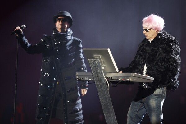 FILE British band The Pet Shop Boys, Neil Tennant, left, and Chris Lowe perform after receiving The Oustanding Contribution To Music award at the Brit Awards 2009 at Earls Court exhibition centre in London, England, Wednesday, Feb. 18, 2009. Forty years and 50 million record sales after the Pet Shop Boys rose to fame with “West End Girls,” the iconic British duo is releasing a new album. “Nonetheless” is their 15th studio album. It arrives Friday, April 26, 2024. (AP Photo/MJ Kim, File)