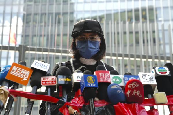 Mrs. Poon, the mother of a young woman killed in Taiwan, speaks to the media outside the government headquarters in Hong Kong, Wednesday, Oct. 20, 2021. Mrs. Poon, whose daughter Poon Hiu-wing was killed while visiting Taiwan in 2018, has lambasted Hong Kong authorities for letting suspect Chan Tong-kai walk free, instead of sending him to Taiwan to turn himself in. (AP Photo/Kin Cheung)