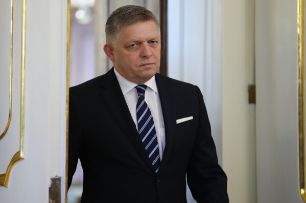 Newly appointed Slovakia's Prime Minister Robert Fico arrives for a swear in ceremony at the Presidential Palace in Bratislava, Slovakia, Wednesday, Oct. 25, 2023. Slovakia's president swore in on Wednesday a new government led by a former populist prime minister who is set to end his country's military aid for Ukraine fighting the Russian invasion. (AP Photo/Petr David Josek)