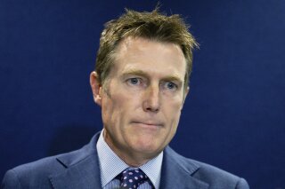 Australia's Attorney-General Christian Porter addresses media in Perth, Australia Wednesday, March 3, 2021. Porter said he was the Cabinet minister accused of a rape 33 years ago and denied any sexual contact with the alleged 16-year-old victim. Porter said he would not step down as Australia’s first law officer, but he would take leave to care for his mental health following the criminal allegations reported against him. (Richard Wainwright/AAP Image via AP)