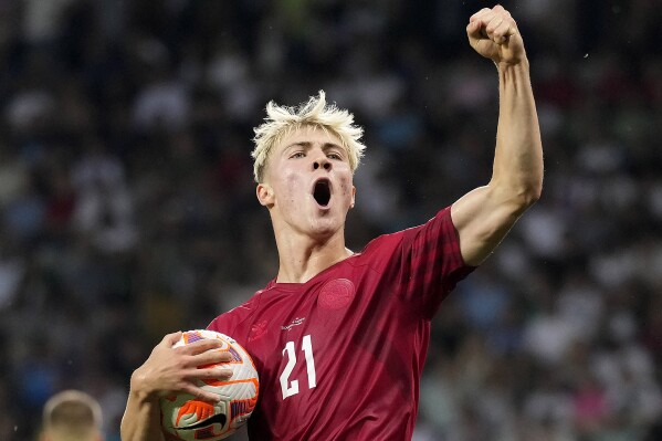 FILE - Denmark's Rasmus Hojlund celebrates after scoring during the Euro 2024 group H qualifying soccer match between Slovenia and Denmark at Stozice stadium in Ljubljana, Slovenia, Monday, June 19, 2023. Manchester United has signed Denmark striker Rasmus Hojlund from Atalanta in a move that ends the Premier League club’s search for a replacement for Cristiano Ronaldo. (AP Photo/Darko Bandic, File)
