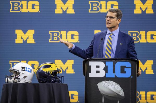 Michigan head coach Jim Harbaugh speaks during an NCAA college football news conference at the Big Ten Conference media days, Thursday, July 22, 2021, at Lucas Oil Stadium in Indianapolis. (AP Photo/Doug McSchooler)