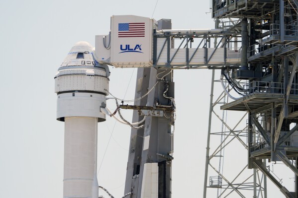 FILE - Boeing's Starliner capsule atop an Atlas V rocket is seen at Space Launch Complex 41 at the Cape Canaveral Space Force Station a day after its mission to the International Space Station was scrubbed because of an issue with a pressure regulation valve, Tuesday, May 7, 2024, in Cape Canaveral, Fla. Boeing is now aiming for its first astronaut launch at the beginning of June. Officials for the company and NASA said Friday, May 24, that weeks of review show that the capsule can safely fly with two test pilots, despite a small propulsion system leak.(AP Photo/John Raoux, File)