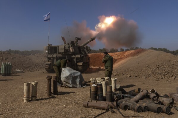 FILE - An Israeli mobile artillery unit fires a shell from southern Israel towards the Gaza Strip, in a position near the Israel-Gaza border, Nov. 6, 2023.Americans have become more likely to describe Israel as an ally that shares U.S. interests and values since the war with Hamas began, but they're divided over whether Israel has gone too far in its response to last month's attack, according to a new poll from The Associated Press-NORC Center for Public Affairs Research. (AP Photo/Ohad Zwigenberg, File)