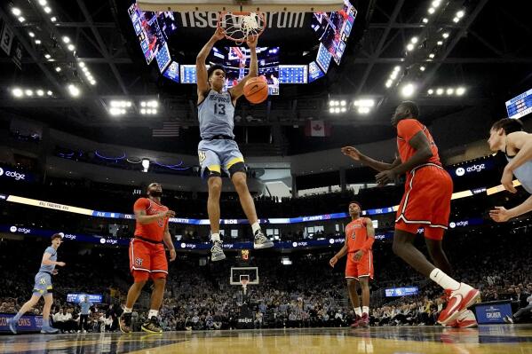 Marquette's Oso Ighodaro dunks during the first half of an NCAA college basketball game against St. John's Saturday, March 4, 2023, in Milwaukee. Marquette won 96-94. (AP Photo/Morry Gash)