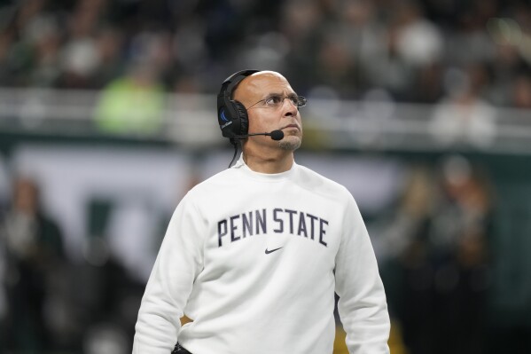 Penn State head coach James Franklin walks on the field during the second half of an NCAA college football game against Michigan State, Friday, Nov. 24, 2023, in Detroit. (AP Photo/Carlos Osorio)