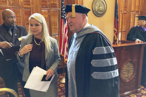 Sonny Perdue lines up for his formal installation as University System of Georgia chancellor on Friday, Sept. 9, 2022 at the state capitol in Atlanta. Perdue, who was Georgia's first modern Republican governor and later U.S. agriculture secretary, started leading the 340,000-student system in April. (AP Photo/Jeff Amy)