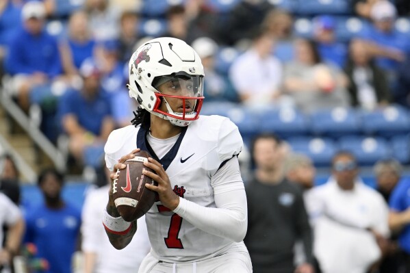 Liberty quarterback Kaidon Salter (7)plays against Middle Tennessee during an NCAA football game on Saturday, Nov. 9, 2024, in Murfreesboro, Tenn. (AP Photo/John Amis, File)