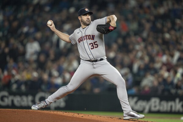 Houston Astros starter Justin Verlander delivers a pitch during the first inning of a baseball game against the Seattle Mariners, Monday, Sept. 25, 2023, in Seattle. (AP Photo/Stephen Brashear)