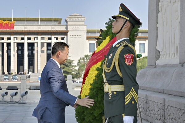 In this photo released by Xinhua News Agency, Cambodian Prime Minister Hun Manet lays a wreath at the Monument to the People's Heroes on the Tiananmen Square in Beijing on Thursday, Sept. 14, 2023. Cambodia's new prime minister, Hun Manet, has arrived in Beijing on his first official trip abroad since taking office last month. He arrived on Thursday and is scheduled to meet with Chinese leader Xi Jinping on a visit that demonstrates Cambodia's warm relations with China, its closest political and economic ally. (Yue Yuewei/Xinhua via AP)