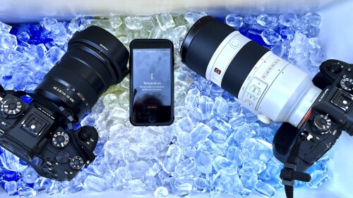 The cameras and cell phone of Associated Press photographer Ross Franklin sit on ice after the devices stopped working after overheating, Thursday, July 20, 2023, in Tempe, Ariz. Phoenix photographers keep coolers for cameras, towels and water in their vehicles when covering extreme heat. (AP Photo/Ross D. Franklin)