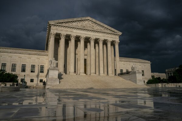 FILE - In this June 20, 2019 file photo, The Supreme Court is seen under stormy skies in Washington. The Supreme Court says it will hear President Donald Trump's pleas to keep his tax, bank and fin...