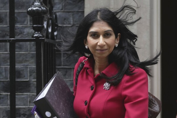 FILE - Britain's Home Secretary Suella Braverman leaves 10 Downing Street to go to the Houses of Parliament in London, on May 22, 2023. Braverman said Monday Sept. 11, 2023 she is seeking “urgent advice” on banning a type of American bully dog, highlighting an attack on a 11-year-old girl over the weekend. (AP Photo/Kin Cheung, File)
