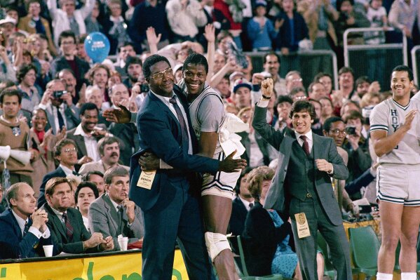 Georgetown University's coach John Thompson sends in replacement
