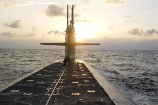 FILE - In this Jan. 9, 2008 photo released by the U.S. Navy, The Ohio-class ballistic-missile submarine USS Wyoming approaches Naval Submarine Base Kings Bay, Ga. The Pentagon's top policy official tells The Associated Press that the United States for the first time has deployed the newest addition to its nuclear arsenal — a submarine-launched weapon that the Trump administration says will make nuclear war less likely. (Lt. Rebecca Rebarich/U.S. Navy via AP)