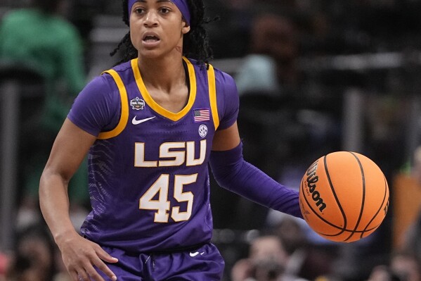 FILE - LSU's Alexis Morris controls the ball during an NCAA Women's Final Four semifinal basketball game against Virginia Tech, March 31, 2023, in Dallas. Former LSU star Morris knows firsthand how hard it is to make a WNBA roster. The guard was drafted in the second round by the Connecticut Sun a few weeks after helping the Tigers win their first championships in 2023, but was cut before the season started. (AP Photo/Darron Cummings, File)