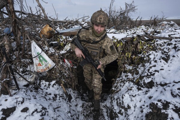 A Ukrainian soldier takes his position on the frontline near Klishchiivka the Donetsk region, Ukraine, Friday, Feb. 19, 2024. (Iryna Rybakova via AP)