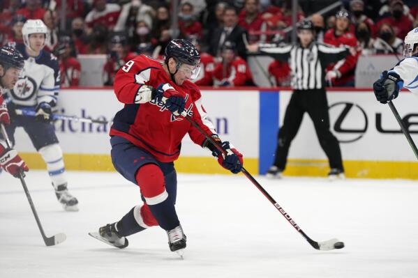 Washington Capitals' Dmitry Orlov shoots the puck in the second period of an NHL hockey game against the Winnipeg Jets, Tuesday, Jan. 18, 2022, in Washington. (AP Photo/Patrick Semansky)