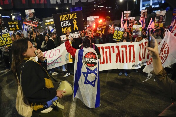 Friends and relatives of the Israeli hostages held in the Gaza Strip by the Hamas militant group attend a rally calling for their release, in Tel Aviv, Israel, Saturday, March 9, 2024. With each passing day, the relatives of hostages in Gaza face a deepening despair. (AP Photo/Ariel Schalit)