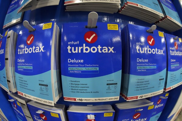 FILE - This is a display of TurboTax on display in a Costco Warehouse in Pittsburgh on Thursday, Jan. 26, 2023. U.S. regulators have barred TurboTax maker Intuit Inc. from advertising its services as “free” unless they are free for all customers, or if eligibility is clearly disclosed. In an opinion and final order, the Federal Trade Commission ruled that Intuit engaged in deceptive practices by running ads claiming consumers could file their taxes for free using TurboTax — when in fact many taxpayers did not qualify for such free offerings. (AP Photo/Gene J. Puskar, File)