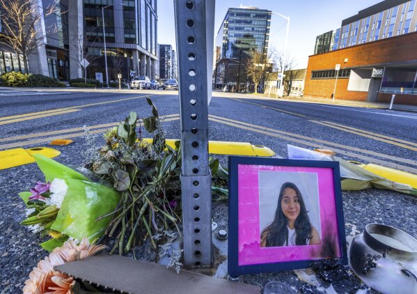 FILE - A photo of Jaahnavi Kandula is displayed with flowers, Jan. 29, 2023 in Seattle. Prosecutors in Washington state said Wednesday, Feb. 21, 2024, they will not file felony charges against the Seattle police officer who struck and killed the graduate student from India while responding to an overdose call. (Ken Lambert/The Seattle Times via AP, File)