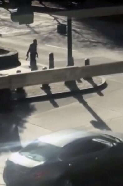 
              This image made from a video provided by Tawhid Kabir shows the suspect in a deadly attack with a fake gun in each hand on Tuesday, Oct. 31, 2017, in New York. The man mowed down pedestrians and cyclists along a busy bike path near the World Trade Center memorial on Tuesday, before he was shot in the abdomen by police after jumping out of the truck, authorities said. (YouTube/Tawhid Kabir via AP)
            