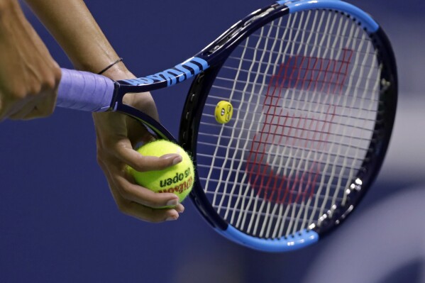 FILE - A tennis player serves during a match at the U.S. Open tennis tournament Wednesday, Sept. 5, 2018, in New York. Saudi Arabia’s move into tennis will now include a multiyear deal to sponsor the WTA women’s rankings. The WTA released word of its partnership agreement with Saudi Arabia’s Public Investment Fund (PIF) on Monday, May 20, 2024, a move that follows last month’s news that the kingdom will host the tour’s season-ending championships in Riyadh starting this year and February’s announcement that it will sponsor the ATP men’s rankings. (AP Photo/Adam Hunger, File)