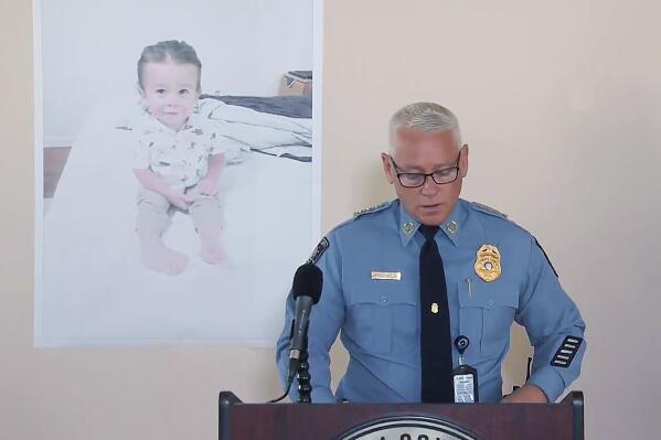 FLE - Chatham County, Ga., Police Chief Jeff Hadley speaks to reporters as he stands in front of a large photo of missing toddler Quinton Simon at a police operations center being used in the search for the boy's remains just outside Savannah, Ga., on Oct. 18, 2022. Leilani Simon, the mother of the toddler found dead in a Georgia landfill, was charged Wednesday, Dec. 14, with murder and other crimes in a 19-count indictment that alleges she used drugs before killing her son and dumping his body in a trash bin. (WSAV-TV via AP, File)