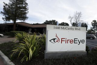 FILE - This Wednesday, Feb. 11, 2015 file photo shows FireEye offices in Milpitas, Calif. The cybersecurity firm that discovered a cyberespionage campaign that has badly shaken U.S. government agencies and the private sector says efforts to assess the impact and boot the intruders remain in their early stages. FireEye has released a tool and a white paper to help potential victims scour their installations of Microsoft's cloud-based email and collaboration software to determine if hackers broke in and remain active.  (AP Photo/Ben Margot, File)