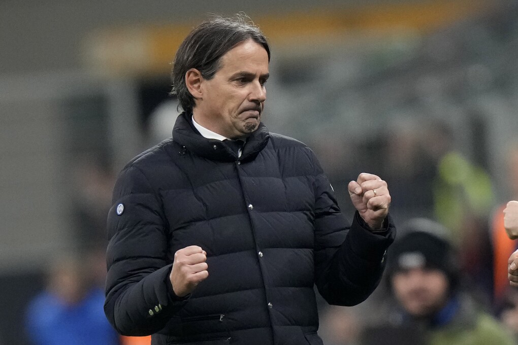 FILE - Inter Milan's head coach Simone Inzaghi, left. celebrates after the end of the Serie A soccer match between Inter Milan and Genoa at the San Siro stadium in Milan, Italy, March 4, 2024. A 2-1 victory over AC Milan in the derby has given Inter Milan a 20th Serie A title and a second star on the team shirts. (AP Photo/Luca Bruno, File)