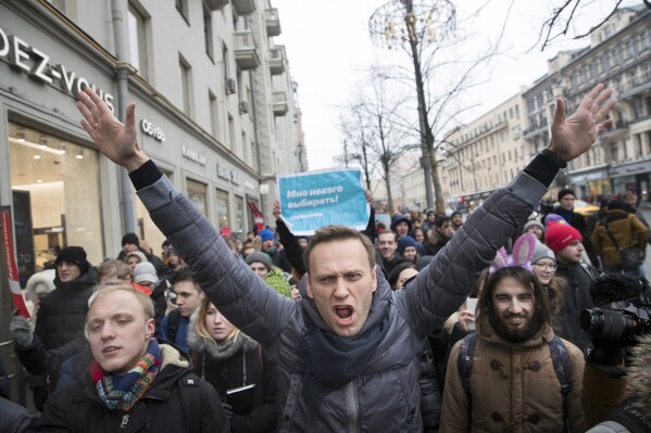 Russian opposition leader Alexei Navalny, center, attends a rally in Moscow, Russia, on Jan. 28, 2018. He died in prison Friday, Russia’s prison agency said. He was 47. (AP Photo/Evgeny Feldman, File)