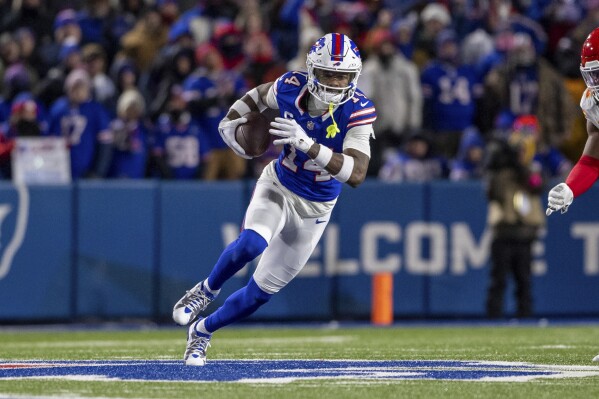 FILE - Buffalo Bills wide receiver Stefon Diggs (14) runs after a catch during an NFL divisional round playoff football game, Sunday, Jan. 21, 2024 in Orchard Park, N.Y. The Buffalo Bills are trading their top receiving threat, Stefon Diggs, to the Houston Texans in a deal that was agreed to on Wednesday, April 3, 2024, a person with knowledge of the discussions confirmed to The Associated Press. (AP Photo/Matt Durisko, File)