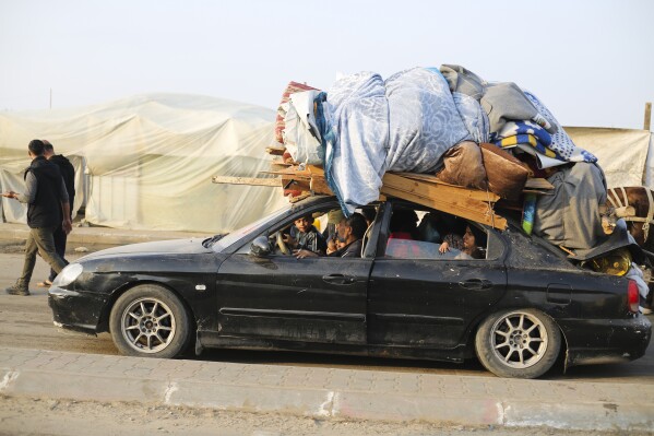 Palestinians fleeing the Israeli bombardment of the Gaza Strip arrive in Rafah Wednesday, Dec. 27, 2023. (AP Photo/Hatem Ali)