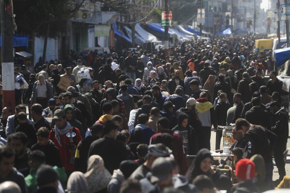 Palestinians crowd a market in Rafah, Gaza Strip, Thursday, Feb. 22, 2024. An estimated 1.5 million Palestinians displaced by the war took refuge in Rafahor, which is likely Israel's next focus in its war against Hamas. (Ǻ Photo/Mohammed Dahman)