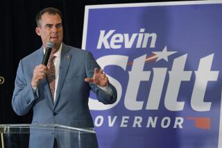 FILE - In this June 28, 2022, photo, Oklahoma Gov. Kevin Stitt talks with the media before his election night watch party in Oklahoma City. A federal audit report sharply criticizes Oklahoma officials for a lack of oversight and accountability in the use of coronavirus relief funds intended for education. The state received nearly $40 million in pandemic assistance for the Governor's Emergency Education Relief, or GEER, Fund, and has returned more than $919,000 that was unspent. (AP Photo/Sue Ogrocki, File)