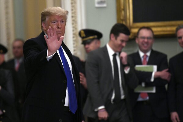 
              President Trump waves as he leaves after attending the weekly Republican policy luncheon on Capitol Hill in Washington, Tuesday, March 26, 2019. (AP Photo/Susan Walsh)
            