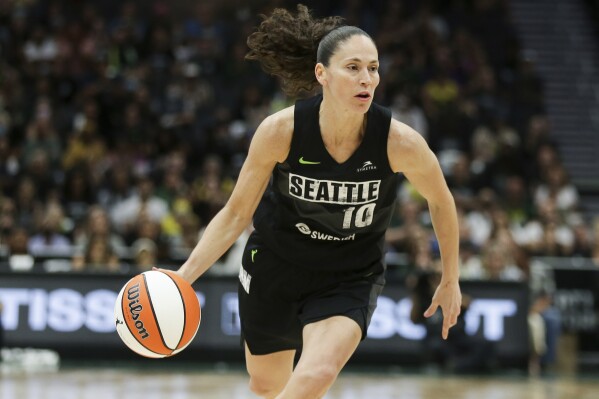 FILE - Seattle Storm guard Sue Bird brings the ball up against the Washington Mystics during the second half of Game 1 of a WNBA basketball first-round playoff series Aug. 18, 2022, in Seattle. The Storm's owners, Force 10 Hoops, said Wednesday, April 24, 2024, that Bird has joined the ownership group. Bird said in a team statement her involvement with the Storm will continue to grow the game. “Investing in women's sports isn't just about passion,” she said. “It's smart business.” (AP Photo/Lindsey Wasson, File)