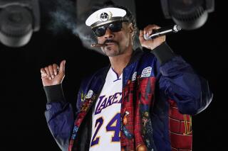 FILE - Snoop Dogg performs a DJ set as "DJ Snoopadelic" during the "Concerts In Your Car" series on Oct. 2, 2020, in Ventura, Calif.  The rapper will join Def Jam Recordings as an executive creative and strategic consultant. (AP Photo/Chris Pizzello, File)