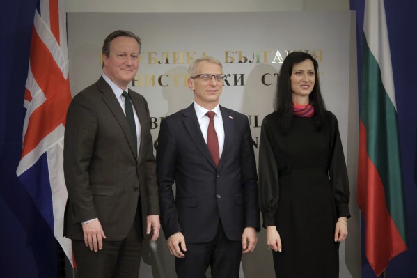 Britain's Foreign Secretary David Cameron poses next to Bulgarian Prime Minister Nikolay Denkov, centre, and Minister of Foreign affairs Maria Gabriel, at the Council of Ministers headquarters in Sofia, Bulgaria, Wednesday, Feb.14, 2024. Foreign Secretary David Cameron is visiting Bulgaria prior to meeting counterparts at the Munich Security Conference. (AP Photo/Valentina Petrova)