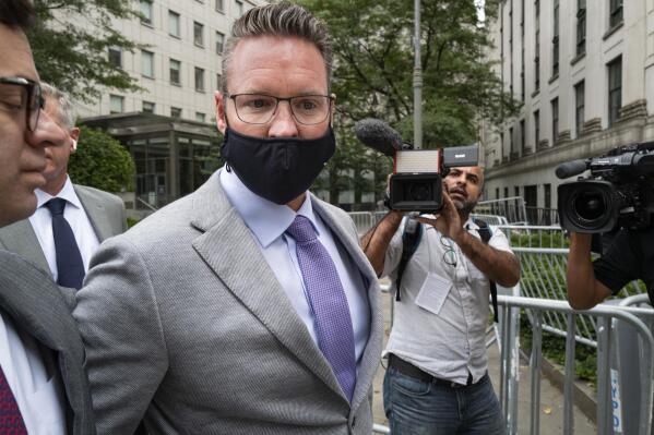 FILE - Nikola founder Trevor Milton leaves a federal courthouse in New York, July 29, 2021. Electric and hydrogen-powered truck startup Nikola has agreed to pay $125 million to settle charges that it defrauded investors by misleading them about its products, technical advancements, and commercial prospects.
The Securities and Exchange Commission said Tuesday, Dec. 21, 2021 that its order finds that Nikola Corp. violated the antifraud and disclosure control provisions of the federal securities laws. In July, Trevor Milton, was freed on $100 million bail after pleading not guilty to charges alleging he lied about the company. (AP Photo/Craig Ruttle, file)